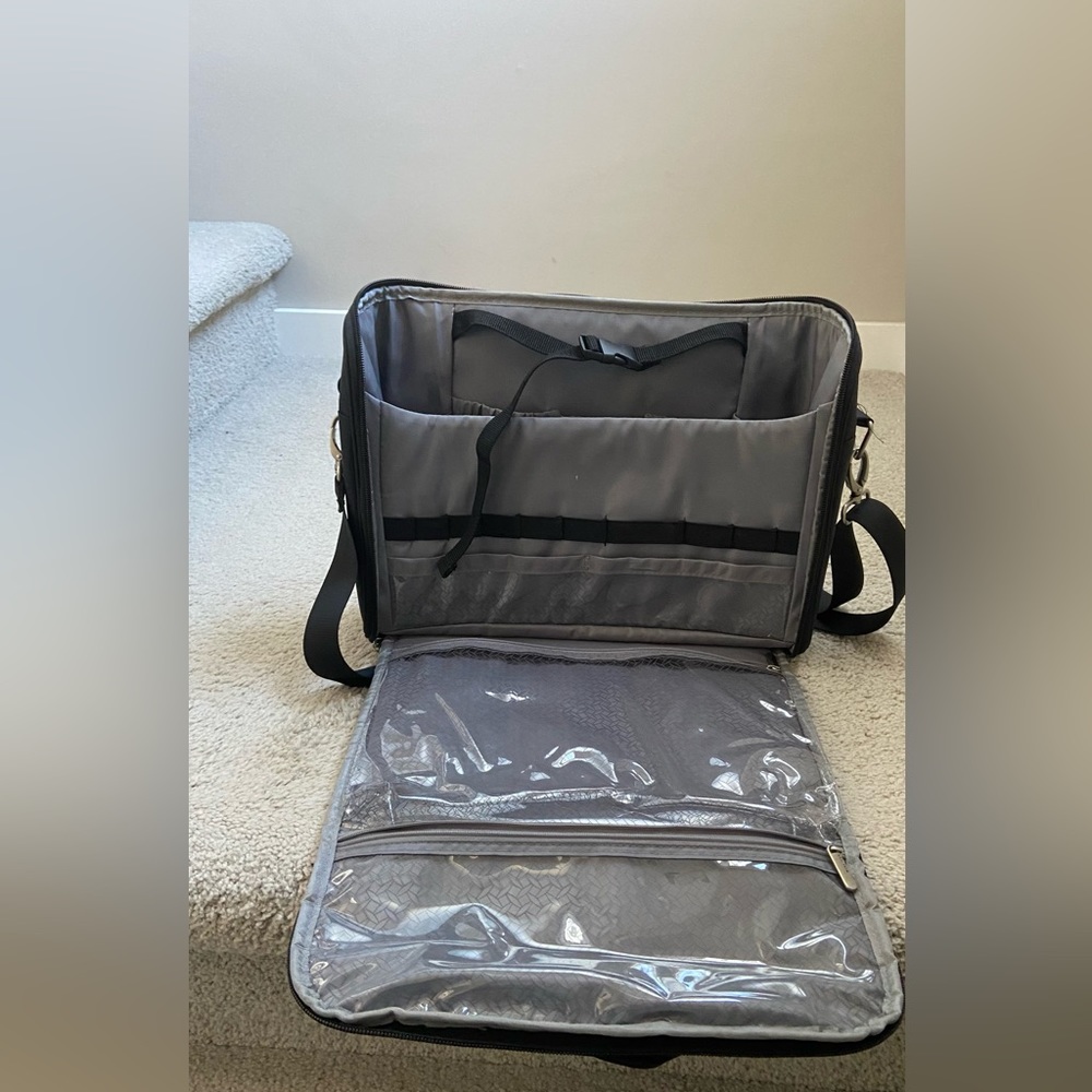 Travelon Toiletry Bag. Lots of pockets and a padded shoulder strap.